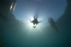 Diver in sunburst, Capernwray. 10.5mm. by Derek Haslam 